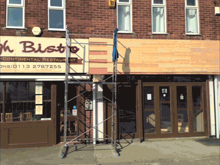 stop motion gif of building of the shopfront for dough leeds restaurant and painting on the logo signage
